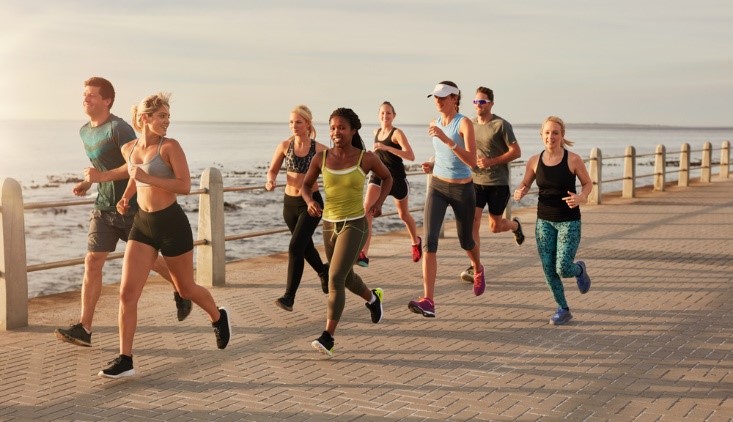 young people running on a bridge