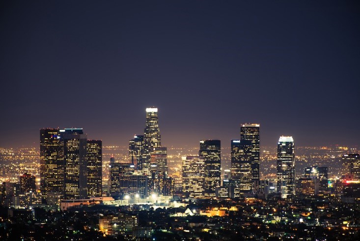 aerial photo of a city at night with sky scrapers
