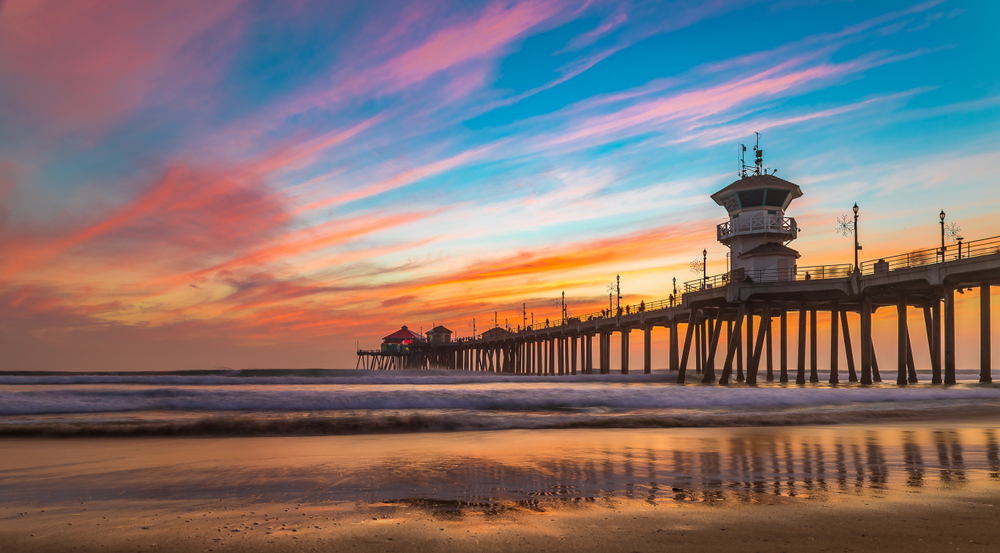 Sunset at a beach with the pier in the background