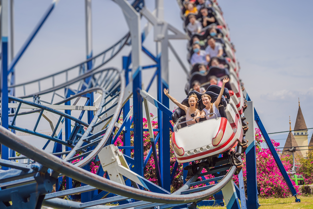 People on rollercoaster, screaming and having fun