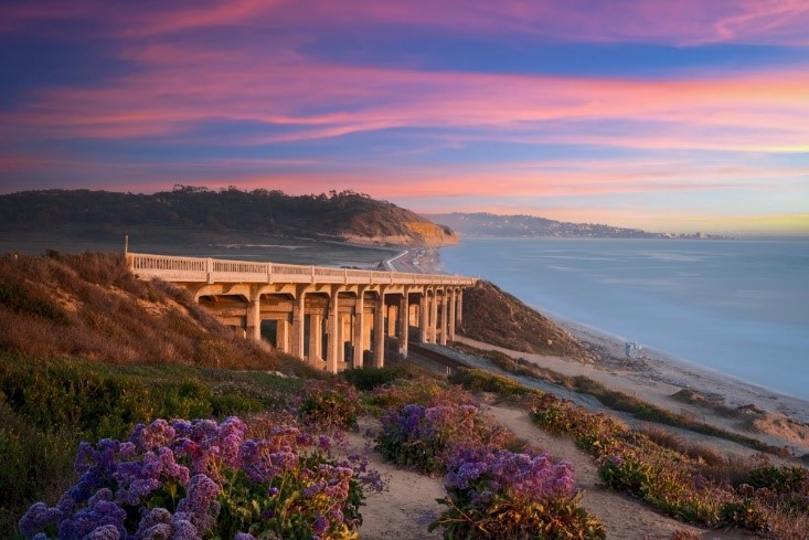 beach and bridge in evening