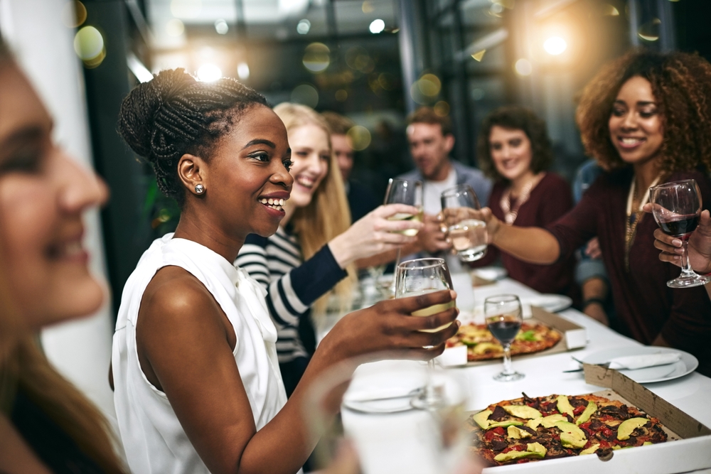 Diverse group of friends eating at a restaurant